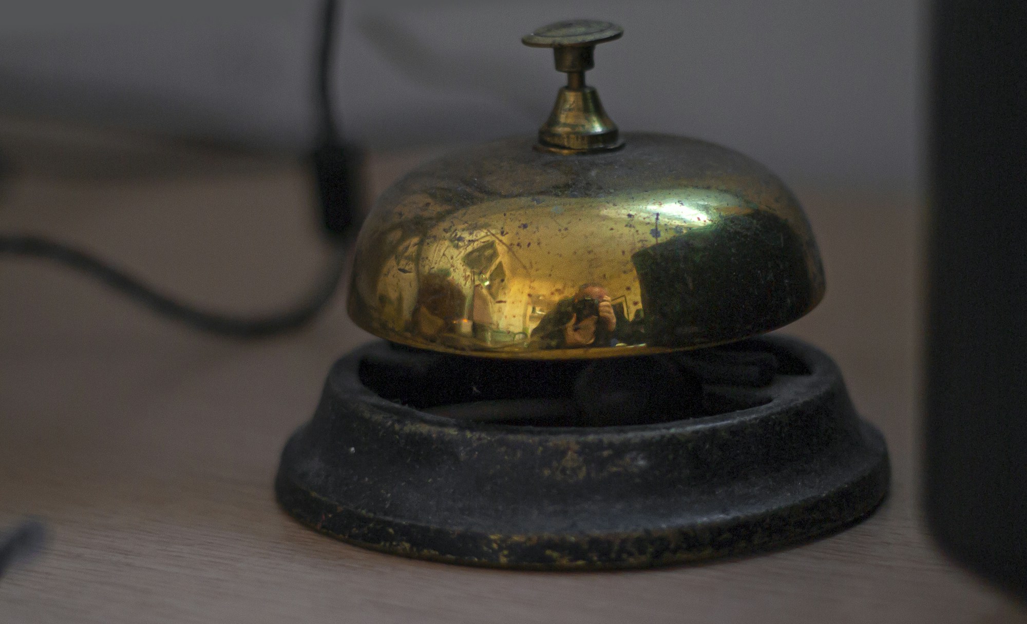 A reception bell on a hotel desk