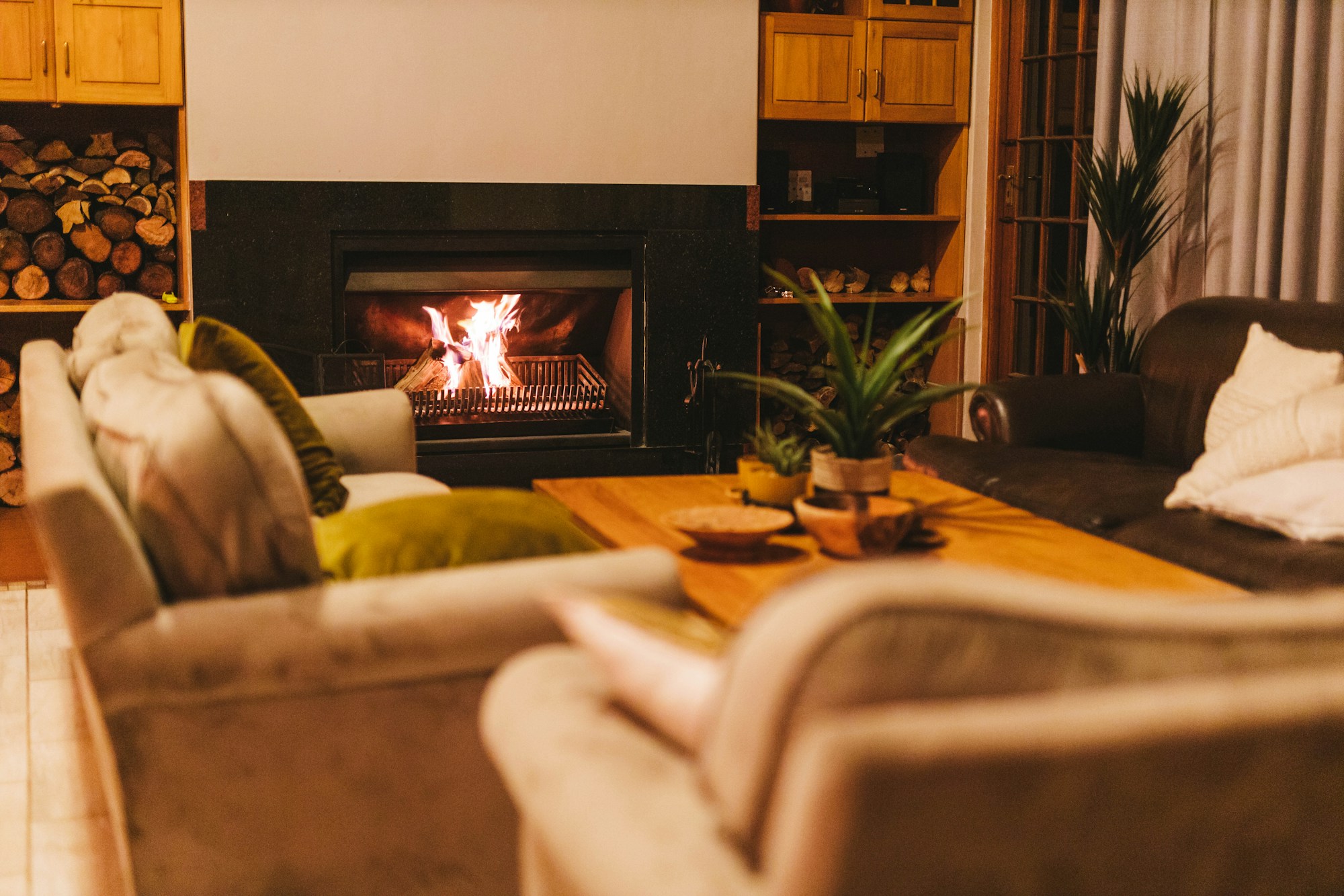 A hotel lounge with a fireplace